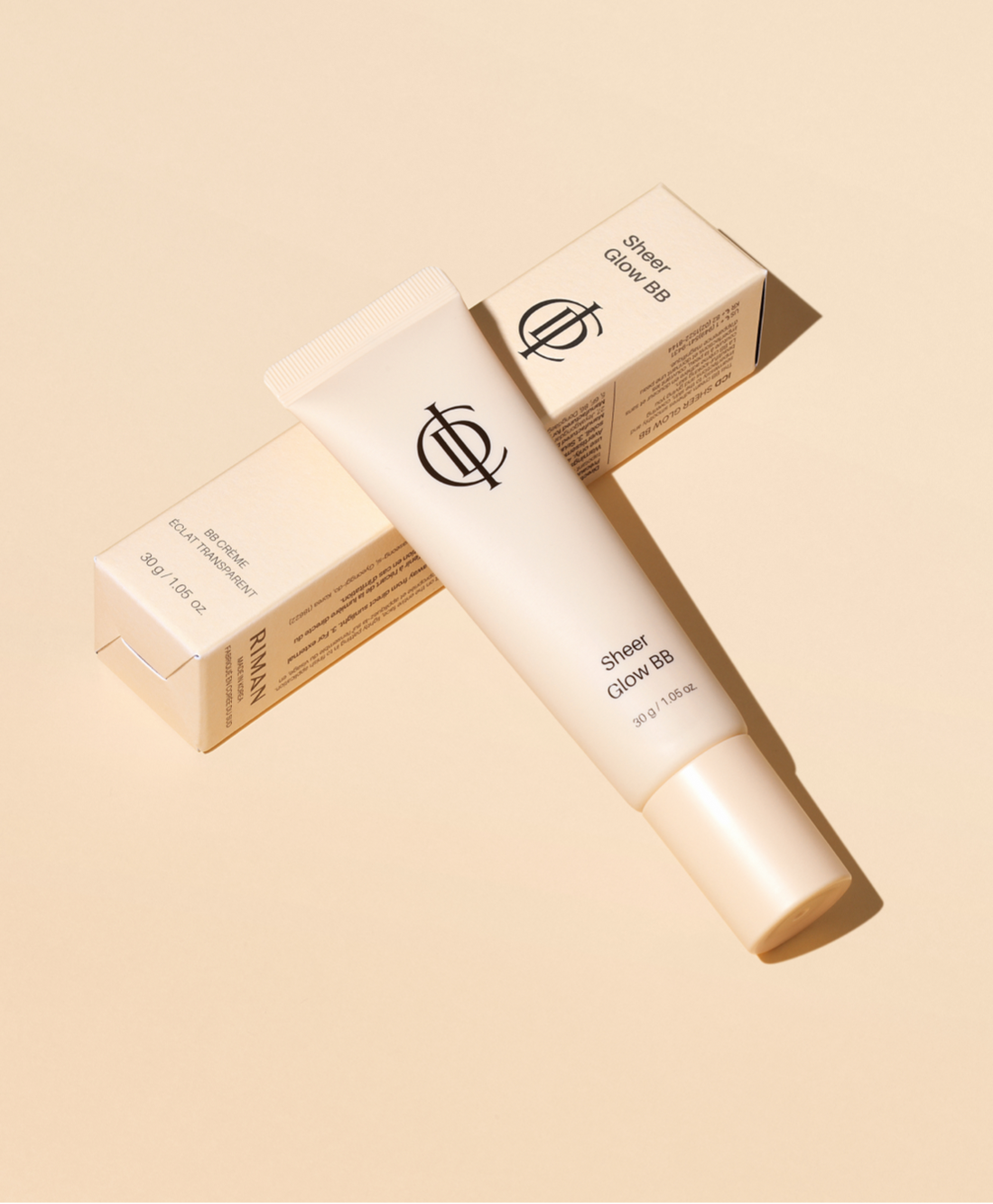 ICD Sheer Glow BB Skincare product with packaging on a beige background