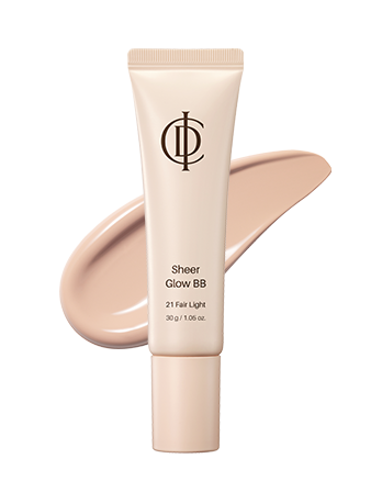 A squeeze tube of ICD sheer glow BB cream in shade 21 Fair Light, shown upright with a matching beige makeup smear behind it on a white background.