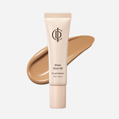 A squeeze tube of ICD Sheer Glow BB in shade 23 Light Medium, shown with a matching liquid makeup swatch behind it on a light gray background.