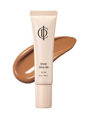 A squeeze tube of ICD Sheer Glow BB 25 Tan foundation shown upright on a white background, with a large smear of the tan liquid foundation behind it.