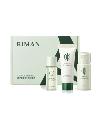 Riman ICD Cleansing Experience Kit featuring a cleansing oil, cleansing col cleanser, and cleansing powder wash arranged in front of their matching light green and white packaging box on a white background.