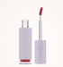 Lip gloss with applicator on a white background