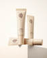 Three tubes of ICD Sheer Glow BB cream on a light background