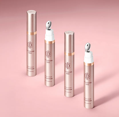 Four cosmetic tubes from the brand RADIANSOME 100 in a metallic rose gold finish, arranged on a soft pink background. Two tubes are open, showing white caps with silver applicator tips, and two are closed.